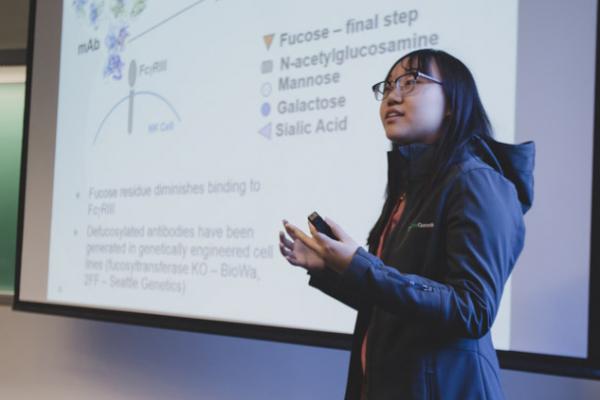 a woman presenting biochemistry research