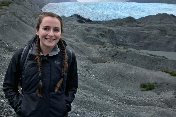 WWU graduate student Gabby Wilson smiling on a mountainside